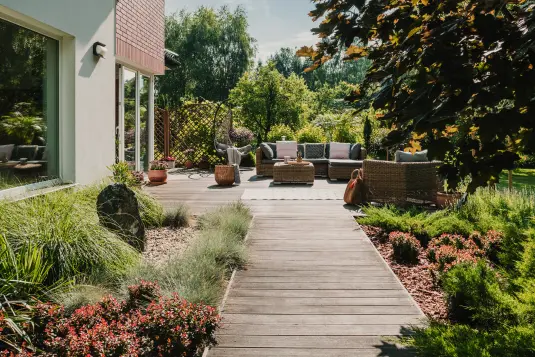 wooden deck pathway leading to outdoor seating on deck