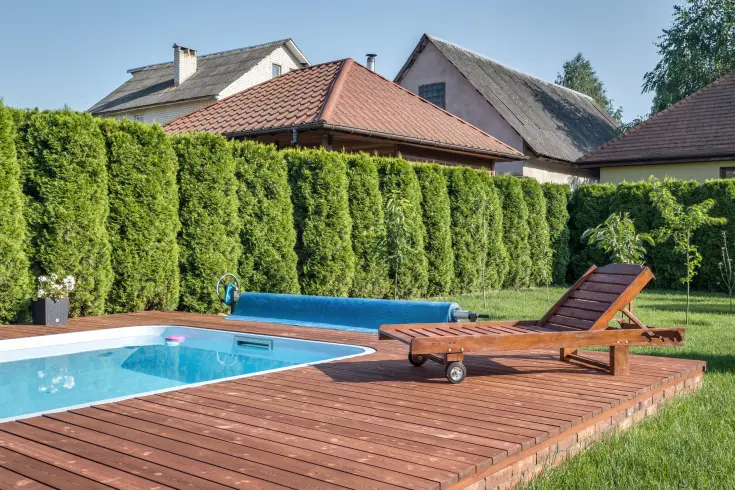 beautiful pool surrounded by wooden deck