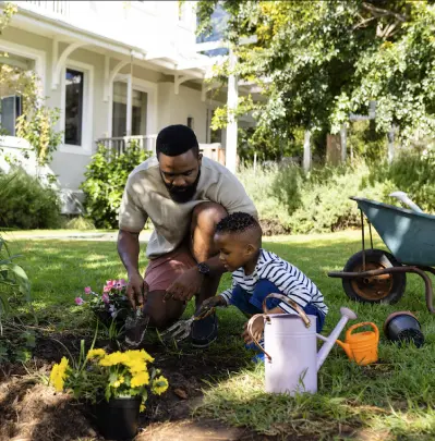 Father and son gardening together